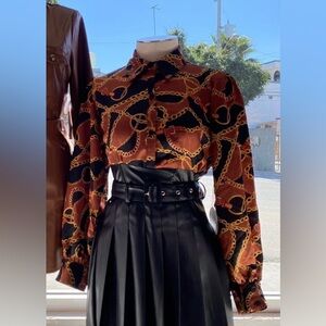 Women’s chain print blouse. Faux leather accent trim